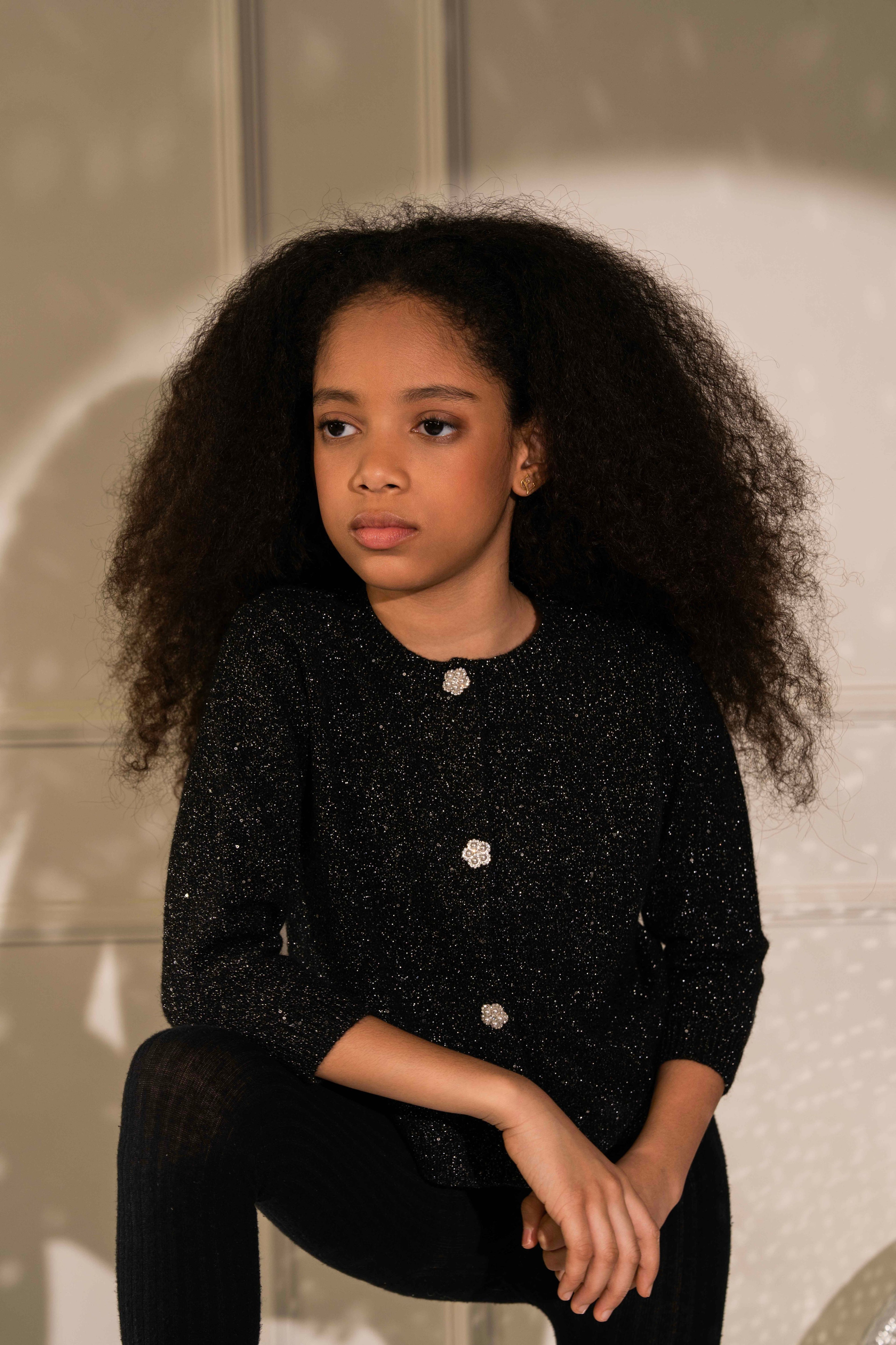 Lady in Black Cardigan by Nino Atelier