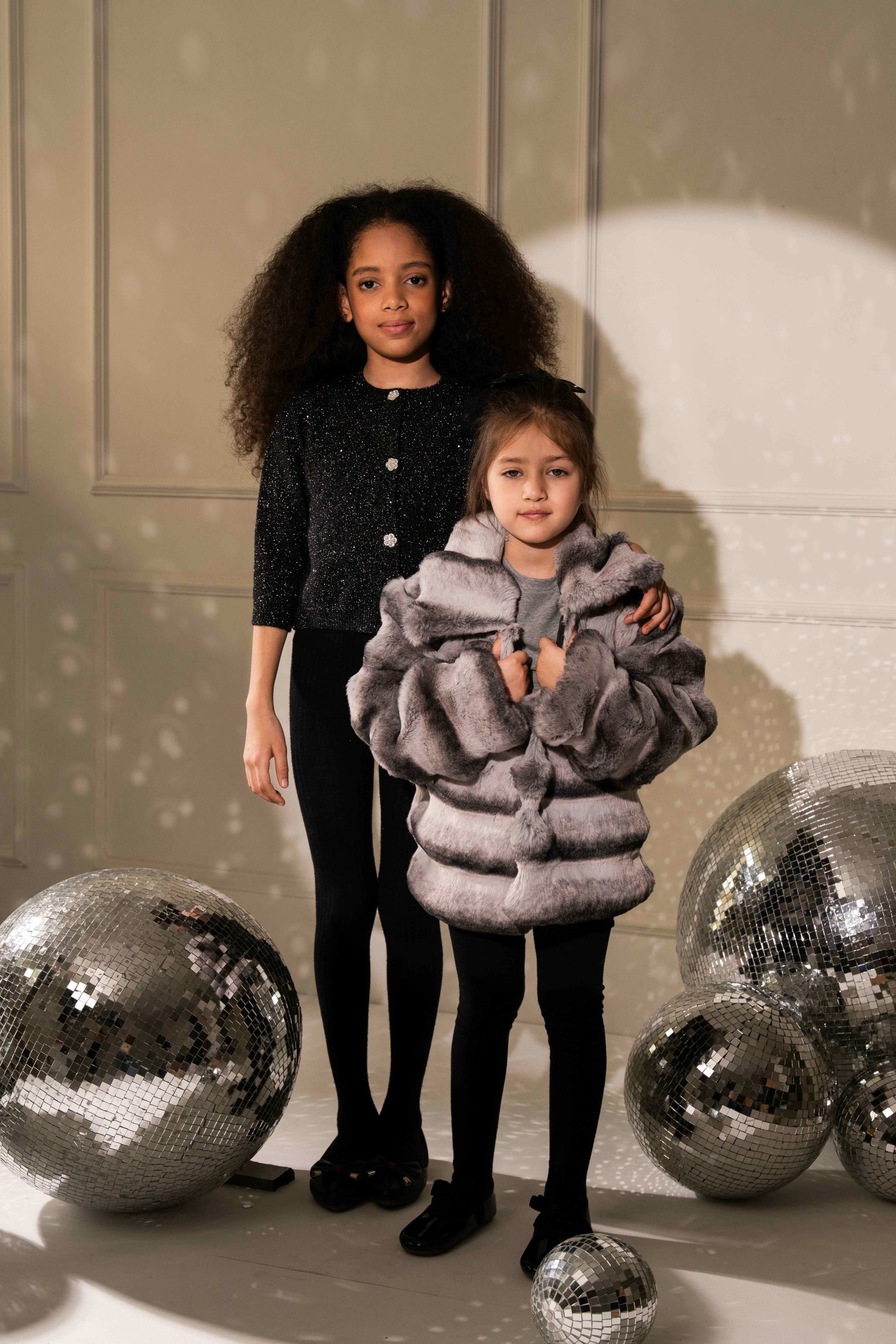 Lady in Black Cardigan by Nino Atelier